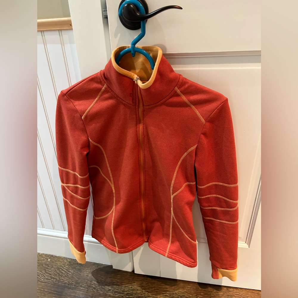 Athleta size small orange running jacket. Cuffs have fold over mittens.